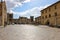 Piazza Roma in Monteriggioni medieval walled town. Tuscany, Italy