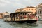 Piazza San Marco / Venezia / Italy - July 06, 2019: Tourists enjoy the ride on the public transport boat Vaporetto on the Grand