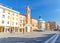 Piazza Tre Martiri Three Martyrs square with traditional buildings with clock and bell tower in Rimini