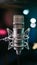 Pic Studio condenser microphone on blurred background, audio equipment photo