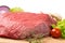 Pice of fresh raw meat with vegetables