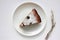 Pice of freshly baked cherry cake on white table background. Overhead view of homemade berry pie.