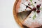 Pice of freshly baked cherry cake on white table background. Overhead view of homemade berry pie.