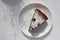 Pice of freshly baked cherry cake on white table background. Overhead view of homemade berry pie.