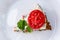 Pice of zucchini cake with tomatoes and fresh parsley on white wooden background