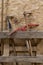 Pickaxe, serfouette, hoe, tools for working the soil in the vegetable garden, stored in a wooden shelter. Close up