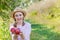 Picking apples. Harvesting apples. Woman with apples in the garden