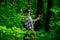 Picking mushrooms. Grandpa Pensioner. Senior hiking in forest. Happy Grandfather. Gathering Wild Mushrooms.