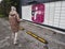 Picking up a parcel from a Mondial Relay locker by a young woman. Lockers Mondial Relay. Pickup box to send and receive parcels.