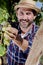 Picking white grapes in autumn vineyard