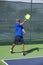 Pickleball Action - Man in Blue Following Through After Serving the Ball