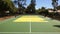 A pickleball court with neatly painted lines