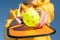 Pickleball paddle and yellow ball close up, woman playing pickleball game, hitting pickleball yellow ball with paddle