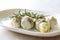 Pickled Artichoke Hearts with Rosemary Marinated in Plate.