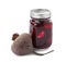 Pickled beets in glass jar and fresh vegetable isolated