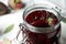 Pickled beets in glass preserving jar on table