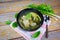 Pickled lettuce soup with spare ribs pork bone soup bowl with vegetable on wood table