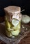 Pickled squash in a jar on a wooden table