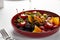 Pickled vegetables in a plate, olives, black olives, stuffed peppers, radishes. Assorted vegetables, vegetables with