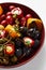 Pickled vegetables in a plate, olives, black olives, stuffed peppers, radishes. Assorted vegetables, vegetables with