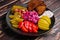 Pickles, cabbage, peppers, bread and garlic spread on a plate