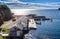 Pickup truck and boats at a cliffside dock in Twillingate.