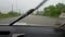 A Pickup truck driving in flooded streets through Belize City, Belize in three feet-deep water..