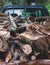 Pickup truck fully loaded with olive tree chopped firewood logs, preparing of woods for fireplace before the winter in Greece,