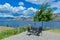 Picnic area with dining table and chairs. Panoramic view of Okanagan lake