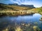 Picnic area at the road to Flodigarry next to Lochan nan Dunan with the Quiraing in the background . Isle of Skye