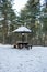 Picnic area with table in the woods in the snow