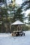 Picnic area with table in the woods in the snow