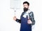 Picnic and barbecue. Cooking meat in park. Masculine hobby. Bearded hipster wear apron for barbecue. Roasting and