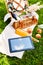 picnic basket, bottle of juice and tablet pc