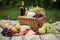 picnic basket filled with fruit, cheese, and wine for sweet and simple picnic