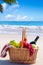 Picnic basket with fruits by the ocean