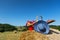 Picnic basket and summer hat in French agriculture landscape