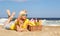 Picnic on the Beach. Blonde Young Woman with Basket of Food