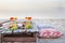 Picnic on the beach at sunset in boho style, food and drink conc