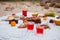 Picnic on the beach at sunset in the white plaid, food and drink