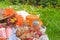 Picnic in the celebration of the king`s day. Lunch in the garden. Basket for a picnic, Fruits and pastries. Orange hat. Spring in