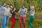 Picnic with friends in at lake near bonfire. Company friends having hike picnic nature background. Hikers relaxing during drink