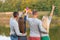 Picnic with friends in at lake near camping tent. Company friends having hike picnic nature background. Hikers relaxing during