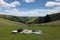 picnic in meadow, with view of the rolling hills and sunshine