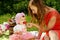 Picnic, mother feeds the child strawberries