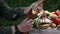 Picnic in nature a tourist breaks off a piece of bread on a fishing trip