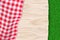 Picnic poster, banner background. Vector illustration of red plaid tablecloth on wooden table and green grass backdrop