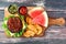 Picnic scene with hamburger, potato wedges and watermelon on a paddle board