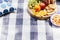 Picnic setting with fresh fruit and snacks