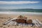 picnic setting on sandy beach with view of the ocean